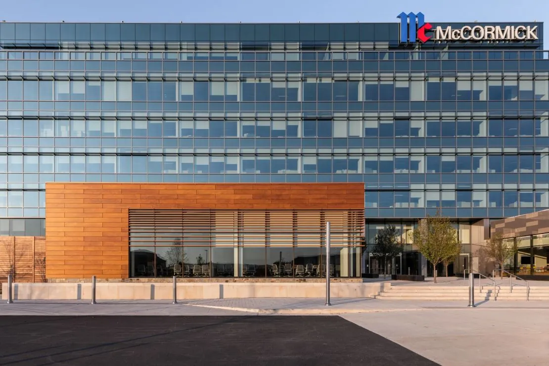 Metal rainscreen cladding framing a completed office entrance