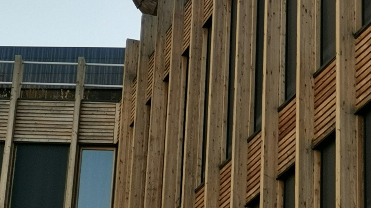 High-pressure laminate rainscreen panel sample with wood-look HPL facade finish