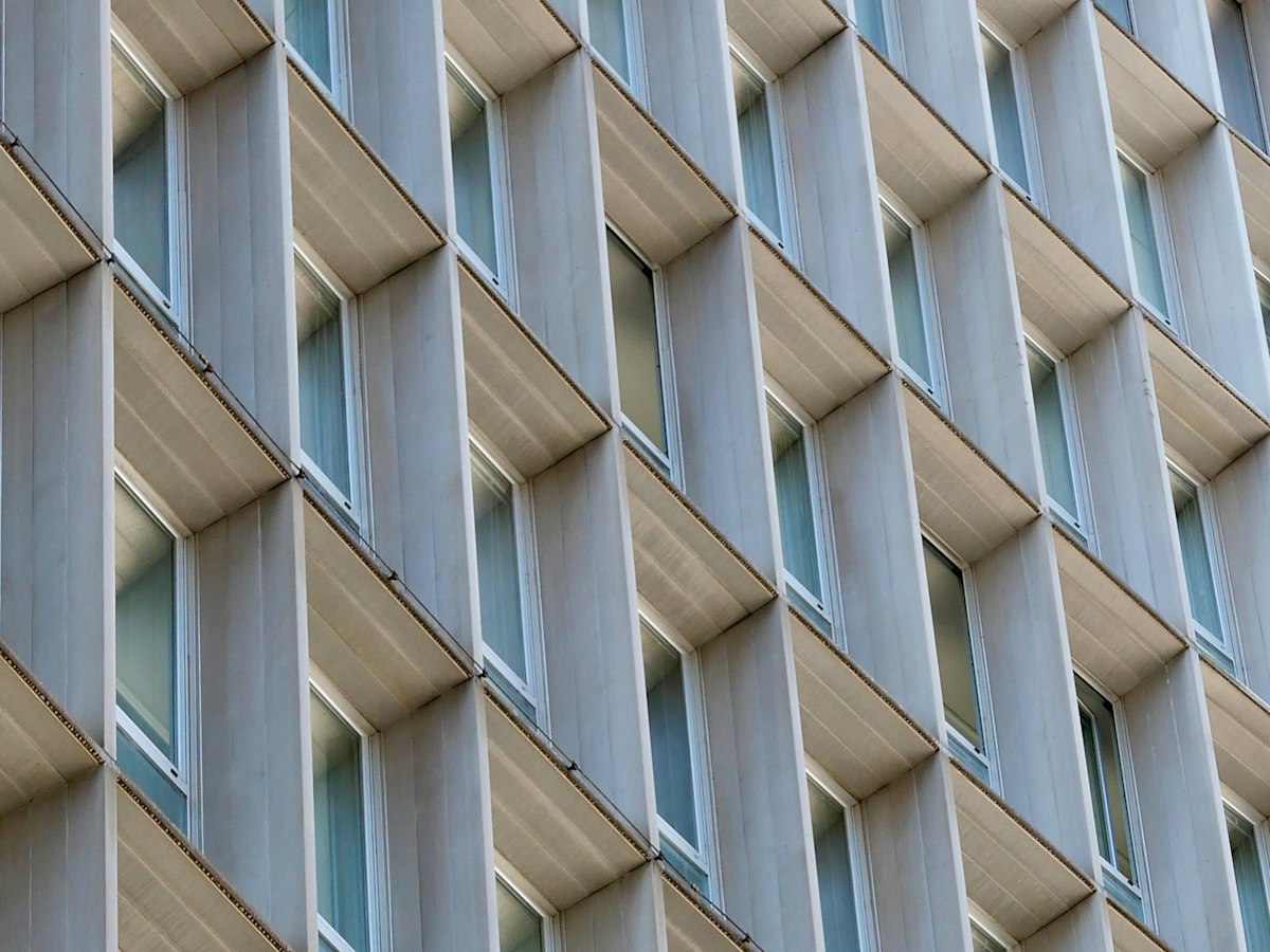 Ultra-high-performance concrete UHPC rainscreen cladding on a high-rise facade for architectural panels