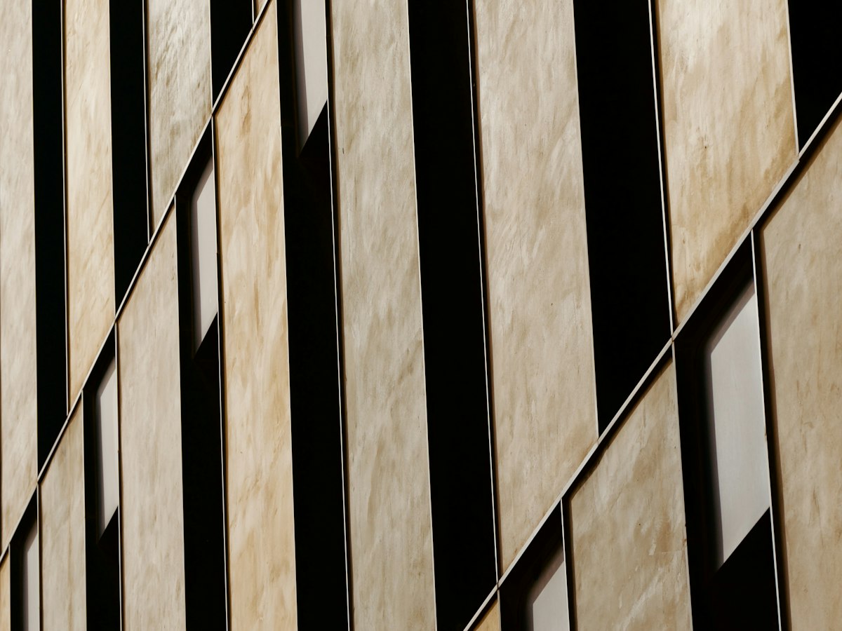 High-pressure laminate HPL rainscreen panels with wood-grain finish for commercial facade cladding